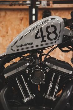 a close up of a motorcycle with the number 48 on it's front tire