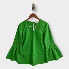 Nwot Michael Michael Kors Grommet Front Bell Sleeve Blouse Michael Michael Kors Grommet Pleated Bell-Sleeve Blouse . Simply Styled, This Top From Michael Michael Kors Is Fashioned With Oversize Grommets With Lacing Detail And Long Bell Sleeves For A Look That Is Totally Chic. Solid Print Color: Green Split Neckline With Grommets Gold Hardware Pleats On Bell Sleeves Xoxo Laced Effect Through Grommets On Sleeves Keyhole At Back With One Button Closure Bell Long Sleeves Size Xs New Without Tags Michael Kors Tops For Spring Workwear, Michael Kors Spring Workwear Tops, Michael Kors Spring Work Tops, Michael Kors Cotton Tops For Spring, Green Bell Sleeve Top For Spring, Bell Sleeve Blouse, Bell Sleeve, Green And Gold, Lace Detail