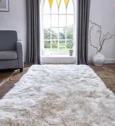 a large white rug in front of a window