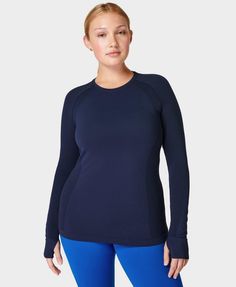 A versatile workout top made for every activity. Lightweight and sweat-wicking fabric. Seamless and high-stretch for all workouts. Slim fit with mesh in high sweat areas. Length 62cm / 24.5". Model wears size S and is 178cm/5'10" tall. Style Code: SB6547Colour: Navy Blue Long Sleeve Gym Tops, Workout Long Sleeve, Base Layer Women, Lightweight Vest, Long Sleeve Workout, Layered Long Sleeve, Compression Fabric, Gym Tops, Sweaty Betty