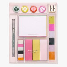 an assortment of stationery items displayed on a white background