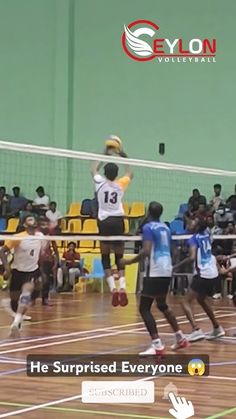 some people are playing volleyball on a court