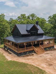 an aerial view of a large house in the middle of a field with lots of trees