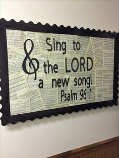 a sign that says sing to the lord and a new song, with music notes all over it