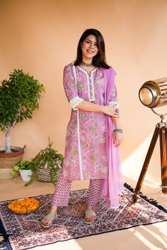 This beautiful  Handblock Kurta suit  set with Dupatta is the most comfortable and classy Indian outfit. Soothing cotton fabric in this Jaipuri block print makes it very elegant. The pants a comfort fit with elastic band that makes the pants roomy.Beautiful lace and shell detailing makes a style statement. 3/4th sleeves and straight line kurta make it comfortable to wear for long hours , can be accessorised and worn at occasions . Specially handmade with love for you by the local Artisans of Jai Purple Cotton Silk Straight Kurta, Pink Kalamkari Print Straight Kurta Salwar Kameez, Pink Straight Kurta Salwar Kameez With Kalamkari Print, Pink Kalamkari Print Straight Salwar Kameez, Cotton Anarkali Set With Printed Border For Diwali, Jaipuri Suits Design, Pink Cotton Sets With Printed Motifs, Pink Cotton Salwar Kameez With Kalamkari Print, Anarkali Cotton Palazzo Set With Printed Border