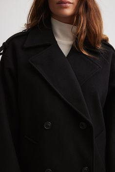 This coat features a short fit. It has a lapel design and a double-breasted button closure. This coat features welt front pockets and a buckle detail on the cuffs. Lapel Design, Future Fashion, Coat Black, Short Coat, Black Coat, Women Empowerment, Double Breasted, Coats Jackets, Buckle