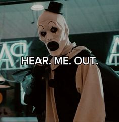 a person wearing a creepy mask with the words hear me out in front of them