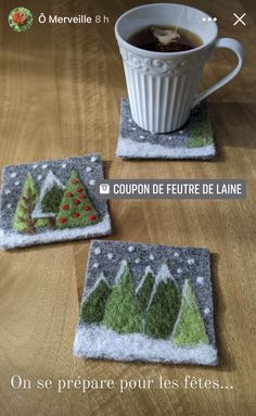 two coasters with christmas trees on them and a cup of tea in the middle