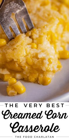 the very best creamed corn casserole is on a plate with a fork