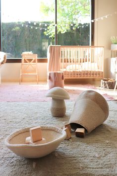 a baby's room with toys on the floor