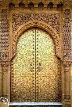 an ornate gold door with intricate carvings on it