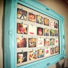 a blue frame with pictures hanging on it