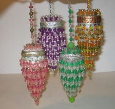 several different colored beads hanging from chains