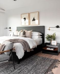 a bedroom with a bed, nightstands and pictures on the wall above it's headboard