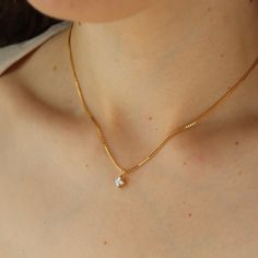 Meet the Quinn Necklace– a modern, yet timeless accessory that's the perfect finishing touch to your holiday look. Our sleek gold chain is embellished with a sparkly, square-cut cubic zirconia that's beautifully set in 14k gold fill. DETAILS14k gold fillAvailable in 16", 18", or 20"Cubic zirconia square pendantHypoallergenic and nickel free Gold Solitaire Necklace With Diamond Cut Cubic Zirconia, Classic Jewelry With Cubic Zirconia Box Chain, Classic Cubic Zirconia Jewelry With Box Chain, Everyday Gold Solitaire Necklace With Single Diamond, Classic Solitaire Necklace With Delicate Chain And Cubic Zirconia, Everyday Cubic Zirconia Diamond Necklace In Yellow Gold, Dainty Yellow Gold Solitaire Necklace With Cubic Zirconia, Dainty Yellow Gold Cubic Zirconia Solitaire Necklace, Everyday Gold Chain Necklace With Cubic Zirconia