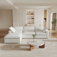 a living room with a white couch and coffee table