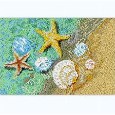 an ocean scene with starfish, shells and other things on the beach area rug