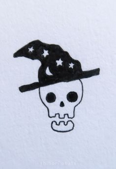 a drawing of a skull wearing a witches hat with stars on it's head