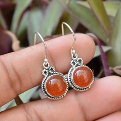 Carnelian Earrings, 925 Sterling Silver, Red Carnelian 10 MM Round Gemstone Earrings, Silver Earrings, Boho Earrings, Beautiful Earrings----------------------------------------------------------------------------------------------------------------------------------------------------Metal: Solid 925 Sterling SilverStyle:  EarringsStone Detail :Natural CarnelianSize 10x10mm Round CabochonWeight-  5.55 Grams Approx  ---------------------------------------------------------------------------------- Amber Carnelian Gemstone Earrings, Round Orange Carnelian Earrings, Orange Carnelian Round Earrings, Orange Gemstone Sterling Silver Earrings, Round Carnelian Gemstone Earrings, Carnelian Gemstone Round Earrings, Orange Carnelian Earrings, Carnelian Round Earrings With Ear Wire, Silver Carnelian Drop Earrings