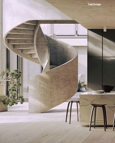 a spiral staircase in the middle of a kitchen with stools and tables next to it