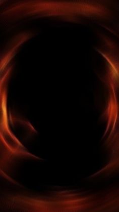 an abstract photo with red and orange swirls in the center on a black background