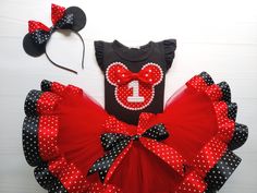 a red and black minnie mouse outfit with matching headband