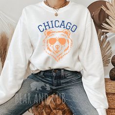 Vintage Chicago Crewneck, Retro Football Sweatshirt, Men's and Women's Sweatshirt, Throwback Chicago Sweatshirt, Gameday Crew, Chicago Shirt *The unisex heavy blend crewneck sweatshirts are pure comfort. These garments are made from polyester and cotton. This combination helps designs come out looking fresh and beautiful. The collar is ribbed knit, so it retains its shape even after washing. There are no itchy side seams on these sweaters.  *Details: .: 50% cotton, 50% polyester .: Medium-heavy fabric (8.0 oz/yd² (271.25 g/m .: Loose fit .: Sewn-in label .: Runs true to size *Unfortunately, we do not accept exchanges, cancellations, or returns since each product is made to order. If you notice an imperfection after receiving your order, please reach out and we will do our best to make it r Chicago Sweatshirt, Football Sweatshirt, Retro Football, Cotton Shirts, Chicago Bears, Apparel Design, San Jose, Cotton Shirt, Mens Sweatshirts