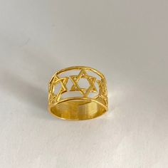 Yellow-gold posted over Sterling silver ring with 3 Stars of David. Width of top is 12.5 mm and of the bottom, 7.5 mm. Three Is Better Than One. David Ring, Star Of David, Sterling Silver Ring, Personalized Jewelry, Ring Earrings, Silver Ring, Sterling Silver Rings, Silver Rings, Yellow Gold