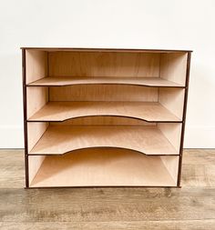 a wooden shelf sitting on top of a hard wood floor