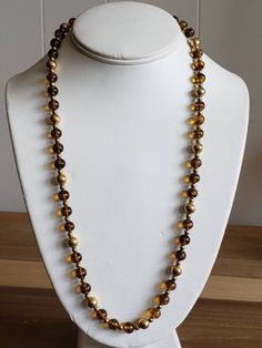 This is a vintage Napier, gold tone metal beads and glass beads necklace. There is a bit of the chain that doesn't have beads on it, as you can see in images. The beads can move on the necklace, slightly. This measures 25.25 inches across. Don't forget to stop in at my other Etsy shop... http://www.etsy.com/shop/xtdesigns. Follow me on Twitter at... MyYiayiaHadThat@MyYiayiaHadThat. If you have a wish list or are looking for something specific, please ask. I may have exactly what you are looking Costume Jewelry Necklaces With Round Beaded Chain, Gold Chain Necklace With Round Beaded Details, Gold Long Necklace With Polished Beads For Gift, Vintage Polished Gold Beads, Vintage Gold Polished Beads, Vintage Gold Jewelry With Beaded Chain, Vintage Large Gold Beads, Gold Beads For Costume Jewelry Party, Gold Beaded Necklaces With Large Beads For Party