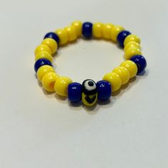 X small minion kid bracelet Blue Adjustable Novelty Jewelry, Playful Adjustable Yellow Jewelry, Yellow Novelty Adjustable Jewelry, Adjustable Novelty Yellow Jewelry, Adjustable Yellow Novelty Jewelry, Fun Yellow Bracelet Jewelry, Playful Yellow Bracelet Jewelry, Minion Bracelet, Christmas Light Necklace