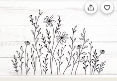 flowers and leaves are drawn on a white wooden background with the words love written in black ink