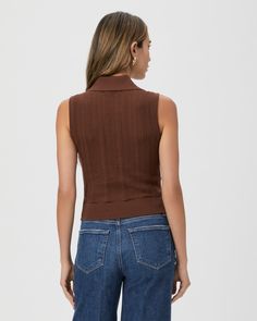 In a luxurious Eco Peachskin fabrication, this retro brown sweater tank is designed with a collared v-neckline and herringbone pointelle stitch detailing throughout. Part of our Eco-Evolution collection, the Rossana Sweater Tank was made from recycled materials to reduce our environmental impact and minimize waste. The goal of our sustainable efforts is to constantly evolve for the better. We are working hard to source environmentally responsible materials that don’t compromise our exceptional q Fitted Pointelle Knit Sweater Vest For Fall, Chic Fitted Brown Sweater Vest, Fitted Chic Brown Sweater Vest, Chic Brown Fitted Sweater Vest, Womens Tan Sweater Vest, Fitted Brown Cotton Sweater Vest, Fitted V-neck Cotton Sweater Vest, Stretch Knit V-neck Vest Top, Stretch Cotton V-neck Sweater Vest