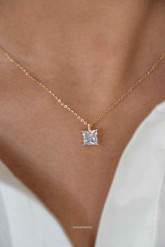 This elegant Princess Cut Solitaire Diamond Necklace is crafted with a high-grade simulated diamond and is plated with 14k gold on sterling silver. It is finished with an anti-tarnish coat and an e-coat for long-lasting preservation of the plating. It's a perfect addition to your jewelry collection and makes a great gift for birthdays, graduations, or for your best friend. PRODUCT DETAILS: * Necklace Length is Adjustable from  15. 5 inches to 17.5 inches with 2 inch of extenders * Comes with 2 i Gold Solitaire Necklace In Sterling Silver, Princess Cut Diamond Solitaire Necklace Gift, Princess Cut Solitaire Diamond Necklace As A Gift, White Gold Princess Cut Necklace For Wedding, Princess Cut Diamond Accents Necklaces For Anniversary, Classic Cubic Zirconia Princess Cut Necklace, Dainty 14k Gold Princess Cut Jewelry, Classic Princess Cut Cubic Zirconia Necklace, White Gold Princess Cut Necklace For Anniversary