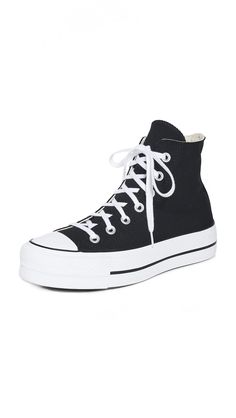 PRICES MAY VARY. Fabric: Canvas Rubber sole Removable insole, Signature logo patch Platform: 1.25in / 30mm Rounded toe Black Converse Platform High Top, Converse High Tops Platform Black, Black Converse Cheap, Low Rise Black Converse, Black Converse Price, Chuck Taylor All Star Lift, Black Converse, Fabric Canvas, Platform Sneaker