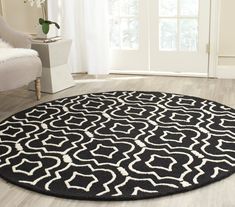 a black and white rug in a living room