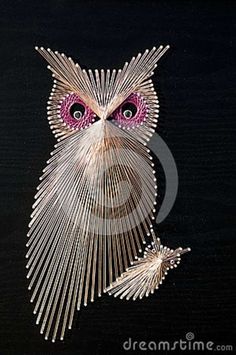 an owl made out of toothpicks