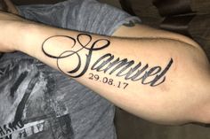 a man's arm with the word samuel written in cursive writing on it