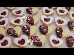 heart shaped cookies are arranged on a table