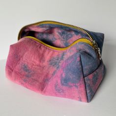 (We're currently building inventory of this new collection but for now, these pieces are made to order. Please allow 2 weeks for your piece to be made and shipped to you!) A sweet little storage piece for every day use. Hand dyed with all natural dyes, pieced and hand sewn by our sewing partners in VT. Perfect for toiletries, stationery, and tote bag or desk organization.Fully lined, 100% CottonMeasures 7x3x4" Handmade Cotton Pouch For Daily Use, Handmade Cotton Rectangular Pouch, Eco-friendly Handmade Pouch For Everyday Use, Handmade Eco-friendly Everyday Pouch, Eco-friendly Handmade Everyday Pouch, Handmade Pink Everyday Pouch, Everyday Handmade Pink Pouch, Toiletries Bag, Desk Organization