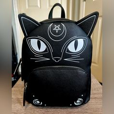 Brand New With The Tags Tik Tok Famous Viral Mad Engine Witchy Black Cat Back Pack In Black And White Adjustable Shoulder Straps Silver Hardware Front Zipper Pocket/Top Loop (H) 11”X (W) 9” 5” Deep Any Questions?? Leave A Comment Black Cat Tik Tok Famous Viral Witch Spooky Halloween Ghosts Skulls Black School Backpack With Cat Design, Black Cat Design Backpack For School, Black Cat Design School Backpack, Black Backpack With Cat Design For Daily Use, Black Cat Design Backpack, Black Cat Design Standard Backpack, Black Backpack With Cat Design, Trendy Black Backpack With Cat Design, Witchy Black Cat