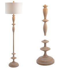 two wooden candlesticks with a white lamp on top and one in the middle