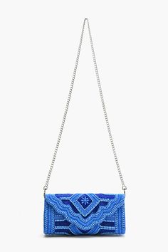 Handmade Flap Clutch All-Over Embellished Beaded Work Made of Cotton Detachable Chain Strap Magnetic Button Closure Inside Zip Pocket Size : 10" x 4.5" x 3" Sparkle and shine with the Cobalt Blue Glamour Clutch—because your outfit deserves a pop of blue!TThis 10 x 4.5 x 3 beauty is packed with all-over beaded embellishments that scream ‘fabulous’. Handmade with love and made from 100% cotton, it’s perfect for adding a splash of glamour to any outfit. Featuring a detachable chain strap for hands-free fun, a magnetic button closure to keep your essentials safe, and an inside zip pocket for your must-haves. Shine bright, clutch tight! Rectangular Blue Beaded Clutch, Blue Embellished Party Clutch, Embellished Blue Party Clutch, Blue Evening Clutch With Chain Strap, Blue Handmade Clutch For Party, Handmade Blue Clutch For Party, Blue Party Clutch With Chain Strap, Animal Print Jumpsuit, Beaded Work