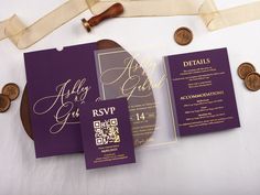 purple and gold wedding stationery with wax stamp on white table cloth next to coins