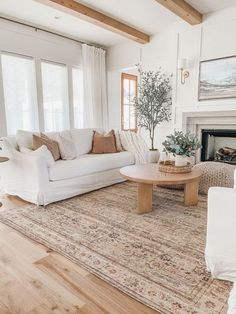 a living room filled with furniture and a fire place