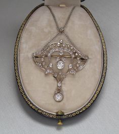 Antique Art Nouveau diamond necklace in 9K yellow gold and 925 silver. 63 pieces of diamond, 2.68 carat. In its original - quite worn - box. It has been hallmarked posteriorly, therefore it has hallmarks that were used from 2016. It is present in the original 1913 catalogue of the jeweller. The jeweller was Franz Joseph's Purveyor to the Imperial and Royal Court. The catalogue is not part of the listing. The inside diameter of the necklace is 45 cm. Originally it can be used as a brooch, but the Antique White Gold Diamond Necklace With Accents, Antique White Gold Diamond Necklace With Single Cut Diamonds, Antique White Gold Diamond Necklace, Vintage Pendant Necklace With Brilliant Cut, Victorian Diamond Necklace With Single Cut Diamonds, Antique Pendant Diamond Necklace With Accents, Vintage Pendant Diamond Necklace With Single Cut Diamonds, Antique Diamond Pendant Necklace With Accents, Vintage Single Cut Diamond White Necklace