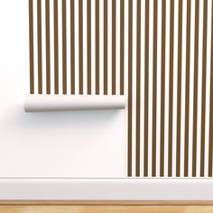 a white wall with brown vertical stripes on it