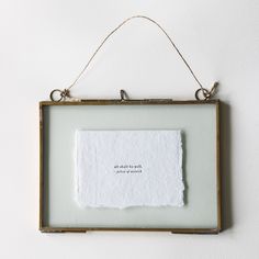 a piece of paper hanging from a frame