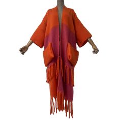 This Colorful Fringe Trim Maxi Cardigan offers a vibrant and stylish addition to your wardrobe. With its colorful fringe trim and maxi length, this cardigan adds a touch of bohemian flair to any outfit. Its lightweight fabric provides comfort while its eye-catching design adds a unique touch to your look. - Color: Multicolor- Style: Sweater-like Kimono- Pattern: Plaid- Sleeve Length: Long sleeve- Material: Polyester- Closure Type: Open front- Details: Stylish plaid cardigan with pop up pocket an Colorful Oversized Long Sleeve Cardigan, Oversized Multicolor Open Front Cardigan, Multicolor V-neck Cardigan With Patchwork, Multi-colored Long Sleeve Patchwork Cardigan, Luxury Multicolor V-neck Cardigan, Plaid Sleeve, Plaid Cardigan, Winter Cardigan, Maxi Cardigan