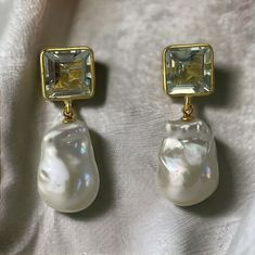 What a beauty This is a natural Green amethyst stone in 24kt gold vermeil, also available in 925 sterling silver bezeled ear post! This handmade green amethyst gemstone with baroque pearl dangling earrings is gorgeous! It is not only a statement earrings but an investment piece!  Available in gold vermeil and sterling silver, pls select, price remains the same.  The Baroque or flameball cultured freshwater pearls are medium size, approx measurements 14mm x 21mm, white, lustrous, AAA quality, whole pearls, top drilled only to attached to a gold filled/925 SS peg.  The ear finding is a beautiful natural Green Amethyst stone, square, faceted, bezel rimmed using 24kt gold vermeil/925 Sterling Silver.  Measures approximately 11mm to 12mm.  Comes with a large sturdy surgical steel ear nuts, gold Elegant Green Amethyst Earrings For Gift, Elegant Green Amethyst Earrings For Formal Occasions, Briolette Pearl Earrings With Gemstone For Wedding, Elegant Green Amethyst Jewelry With Matching Earrings, Elegant Gold Earrings With Green Amethyst, Handmade Elegant Green Amethyst Jewelry, Elegant Handmade Green Amethyst Jewelry, Statement Wedding Earrings, Pearl Drop Earrings Wedding